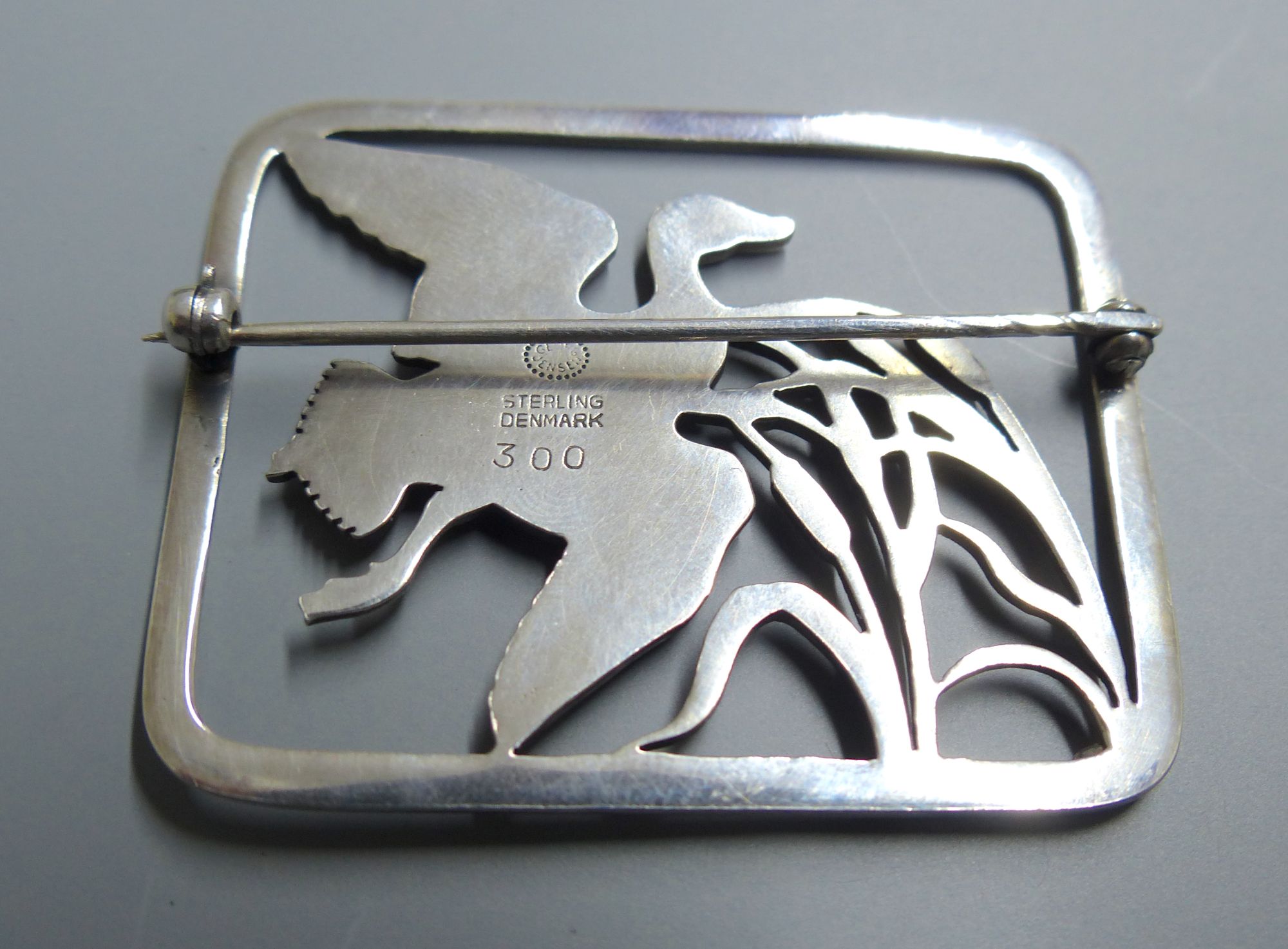 A Georg Jensen sterling Flying duck amid bulrushes rectangular brooch, no. 300, 47mm.